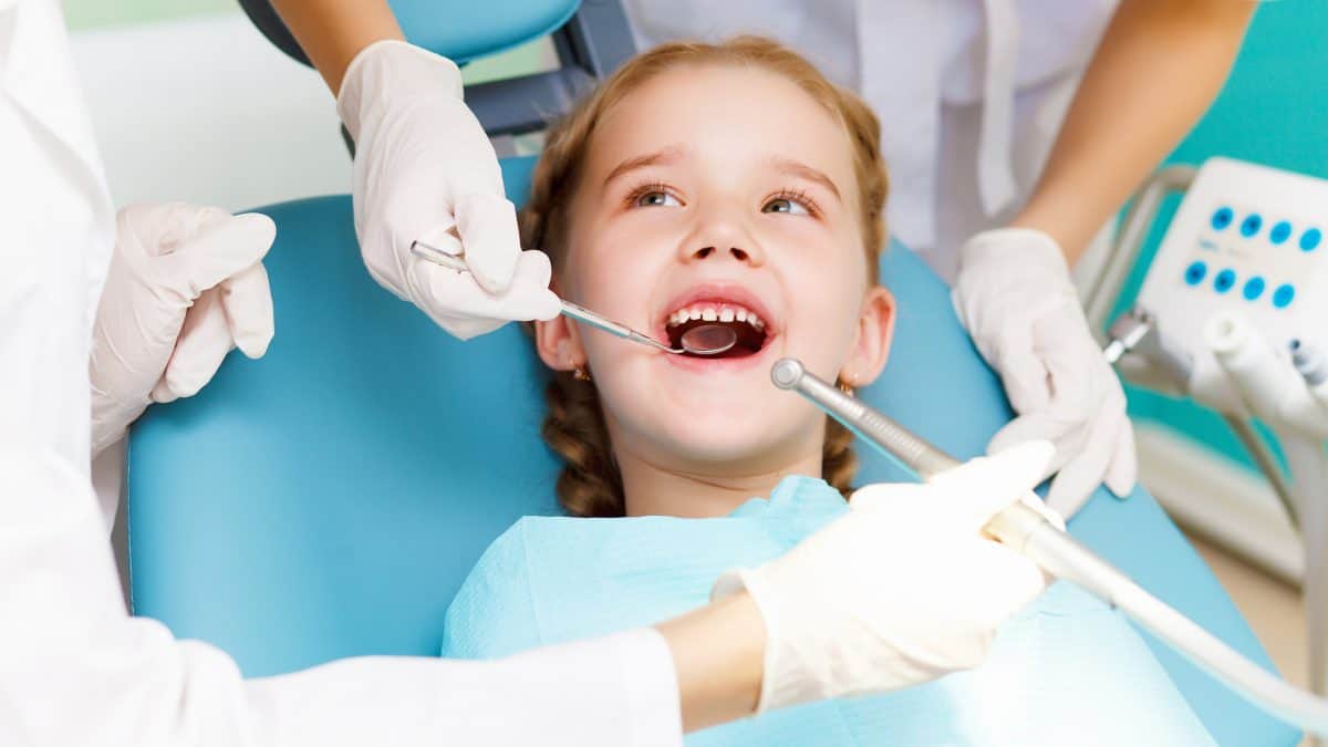 Child smiling during a dental checkup